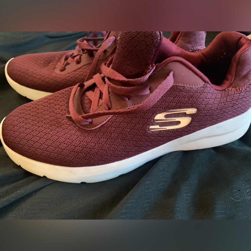 Woman’s burgundy Skechers